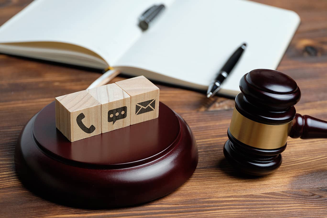 stock photo of gavel and blocks with ways to contact the firm